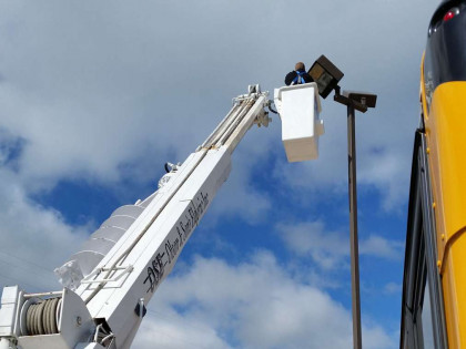 Electrician Working On Parking Lot Wiring