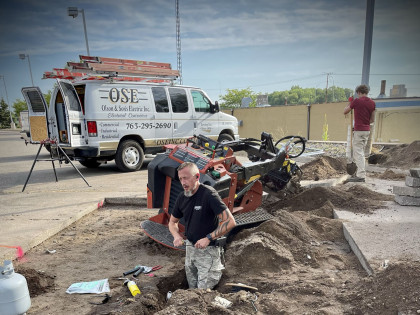 Electricians Working On Underground Wiring